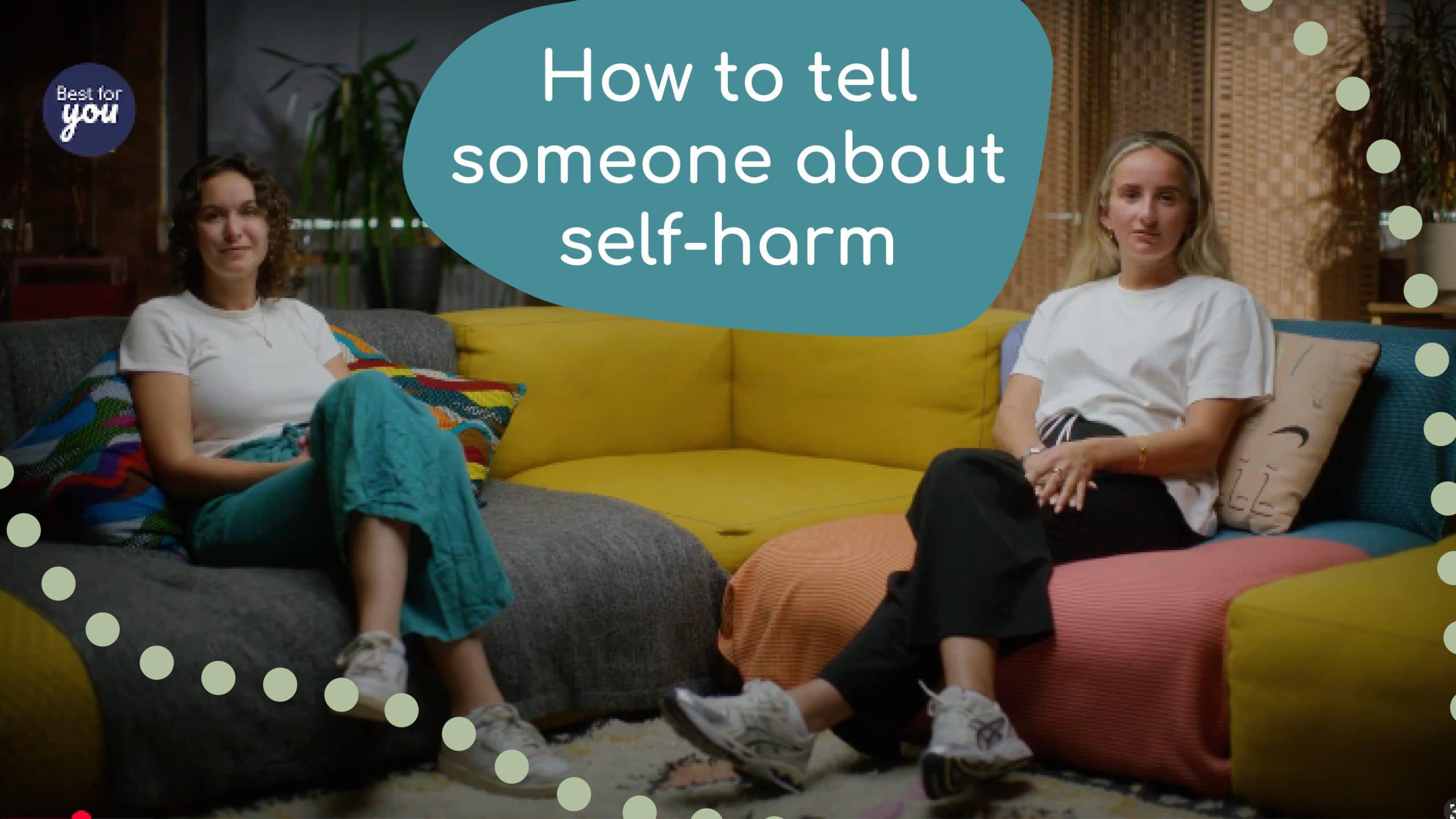 Thoughtful women sitting on colourful couches discussing self-harm awareness and support strategies.