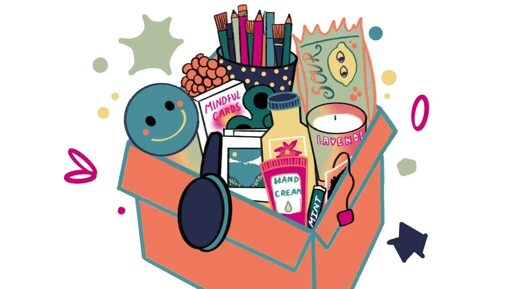Relaxation and self-care items including mindfulness cards, hand cream, lavender spray, headphones, and stationery in a box for mental wellness.